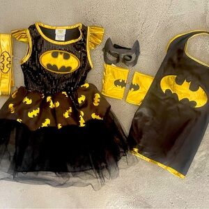 Includes dress, cape, cuffs, belt and mask. size 3t/4t